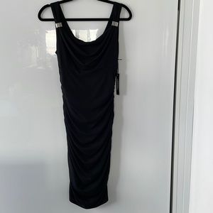 Slimming White House Black Market black dress. New with tags, size 6.